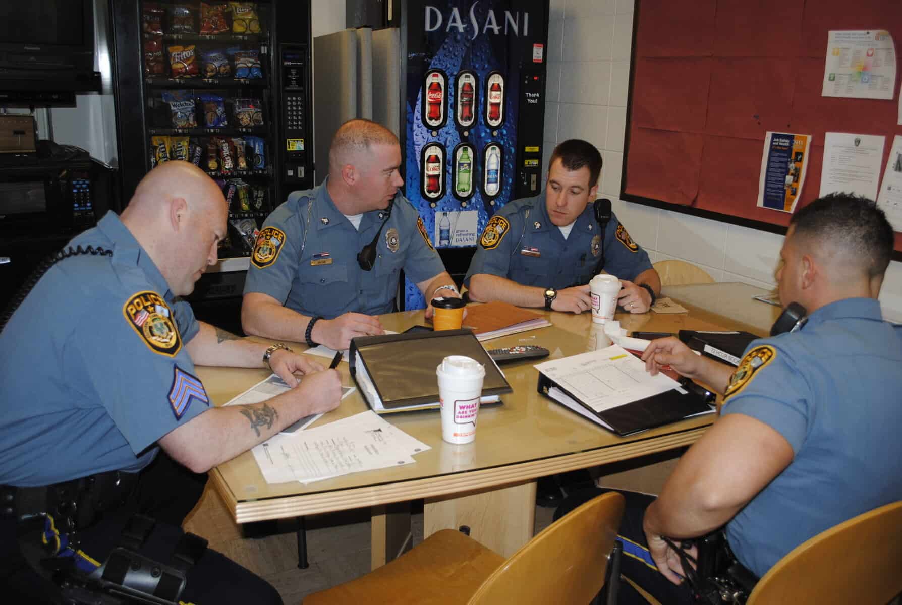 photo courtesy | SHAUNNA CULLEN Roll call for several officers getting ready to go out for the night shift, 11 p.m. to 3 a.m.
