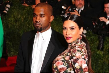 Kanye West, left, with a pregnant Kim Kardashian, right.