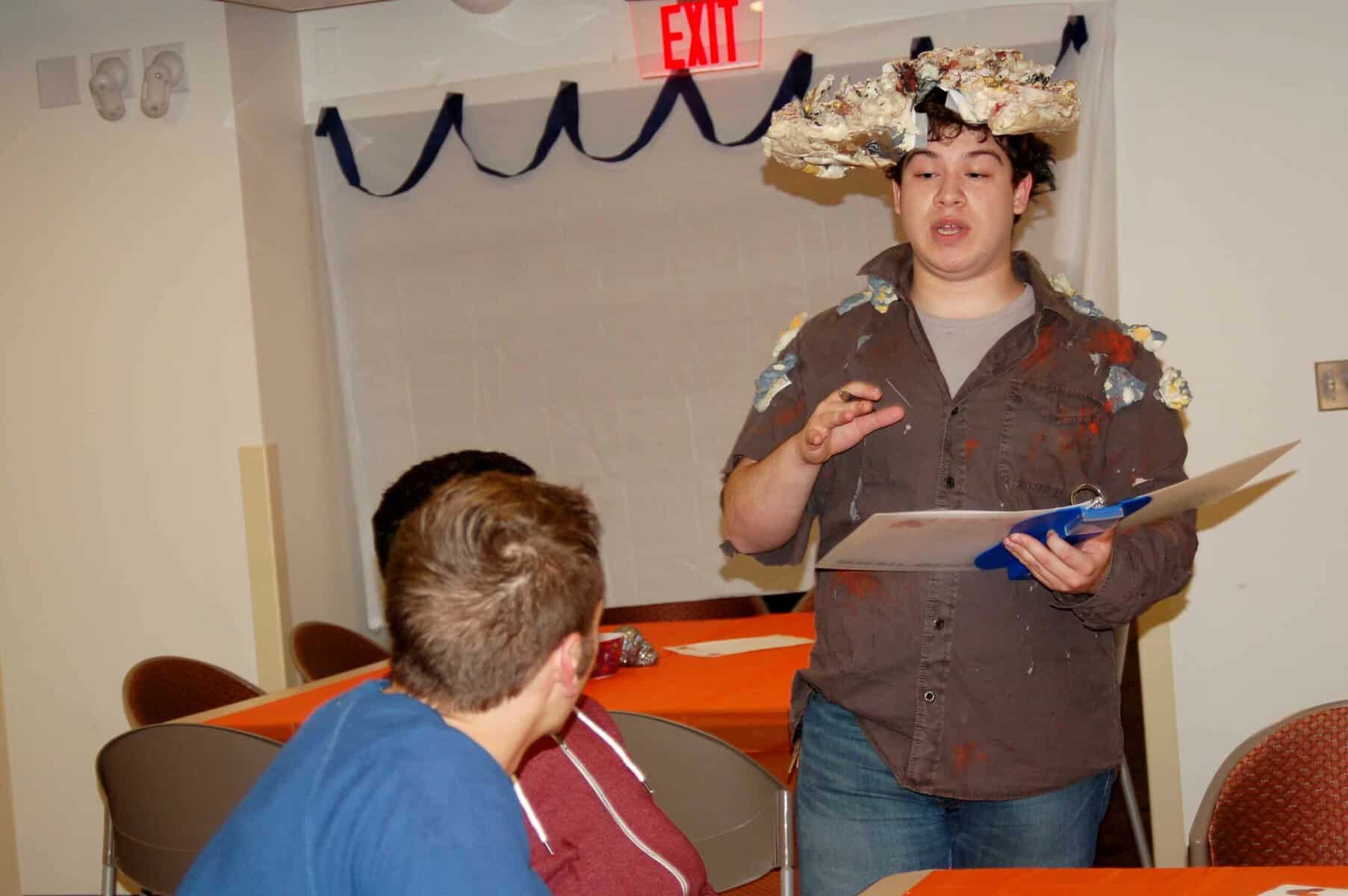 Member of the Anime Society takes students' orders.