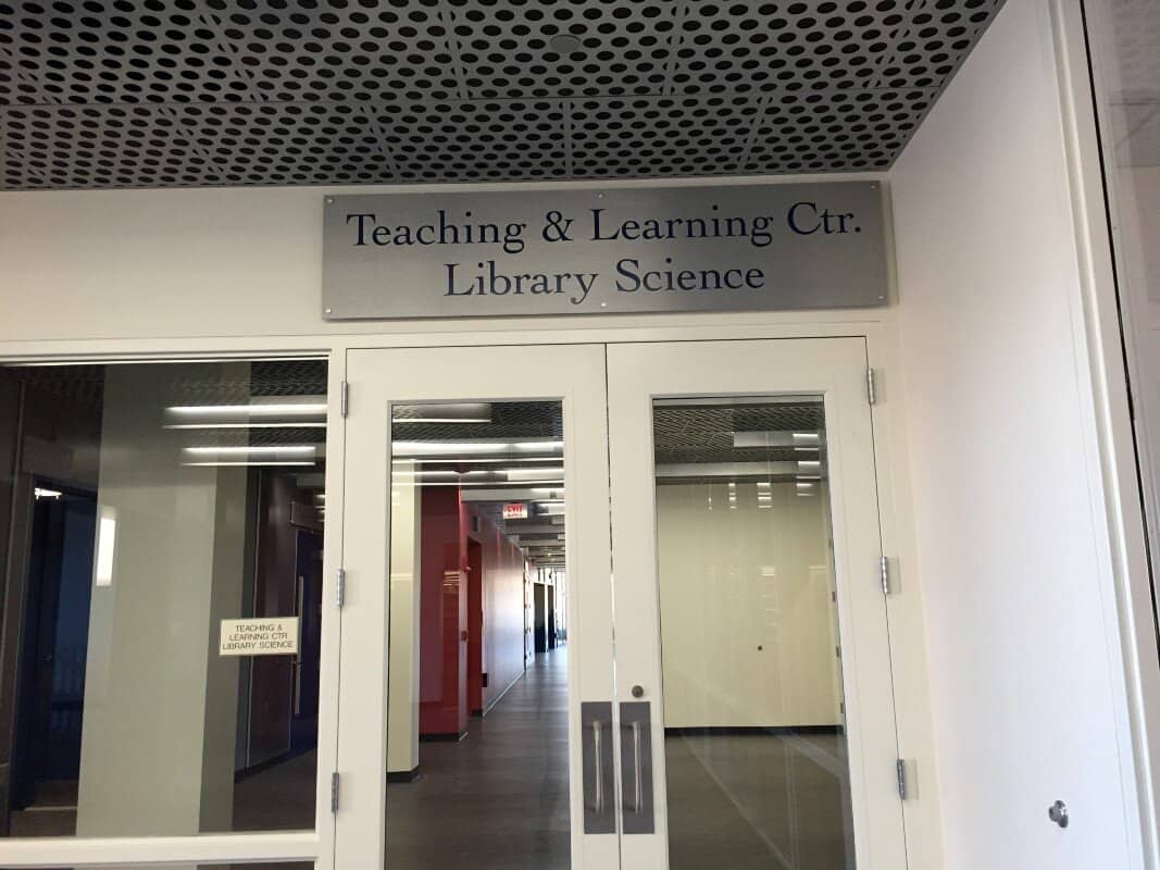 The sign above the new wing. A work in progress De Oliveira said as she points out that the name is actually the Academic Success Center. They hope a new sign will be ready for the fall. Photo by, Olivia Cintron